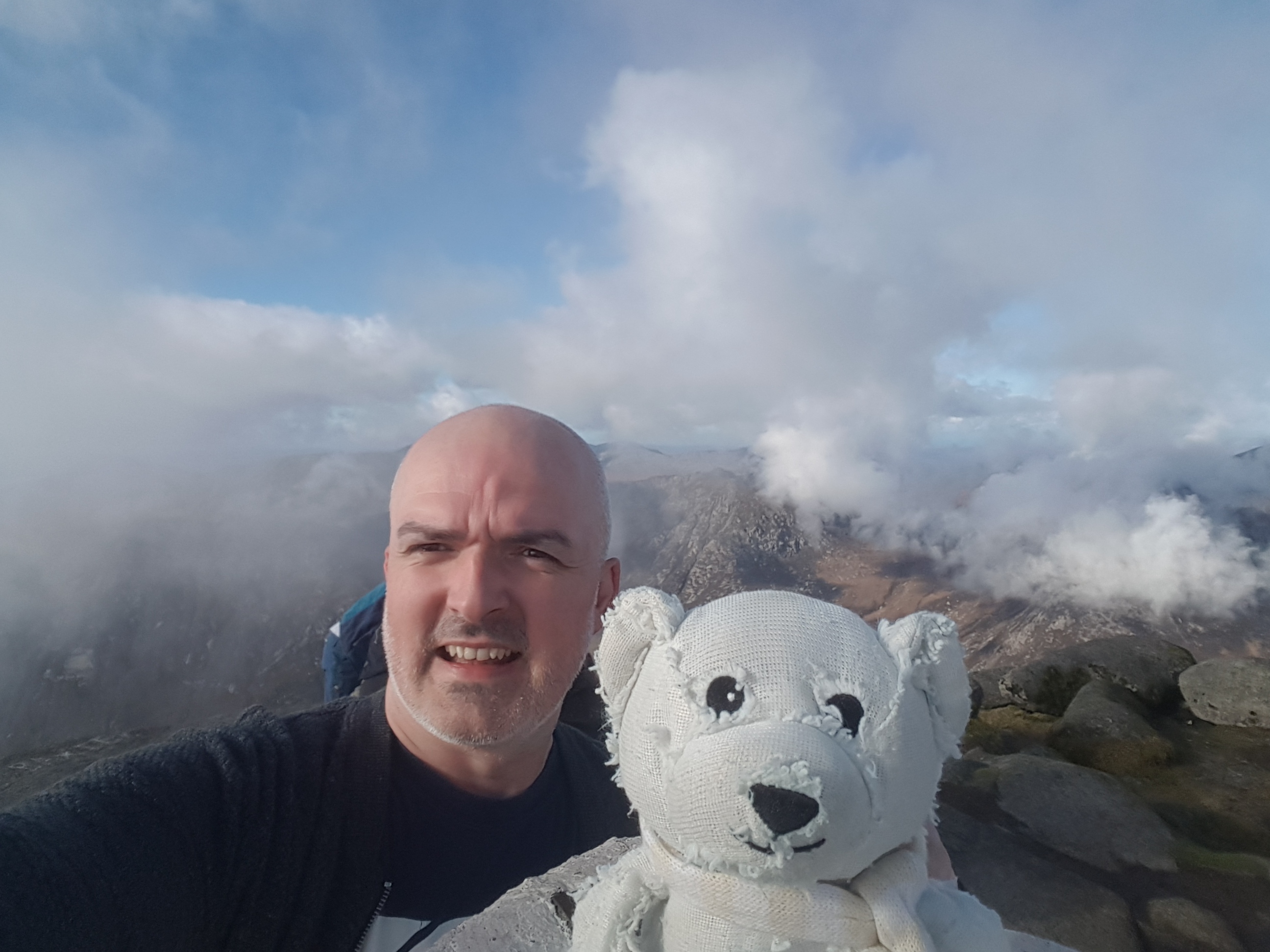 Me (and a friend) at the summit of Goat Fell